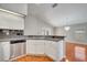 Kitchen featuring stainless steel dishwasher and breakfast bar at 3084 Stillwater Dr, Kissimmee, FL 34743