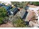 Aerial view of neighborhood home with solar panels on roof and fenced-in backyard at 3623 S Saint Lucie Dr, Casselberry, FL 32707
