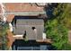 Aerial view shows roof and backyard with mature trees in a residential neighborhood at 3623 S Saint Lucie Dr, Casselberry, FL 32707