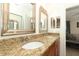 Bathroom with double vanity featuring granite countertops and an attached Primary bathroom at 3623 S Saint Lucie Dr, Casselberry, FL 32707