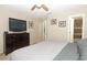 Spacious bedroom featuring a bed set, ceiling fan, and walk in closet at 3623 S Saint Lucie Dr, Casselberry, FL 32707