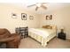 Cozy bedroom with ceiling fan, comfortable seating, and neutral-toned walls at 3623 S Saint Lucie Dr, Casselberry, FL 32707