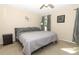 Bedroom featuring a gray bed set, matching nightstand, and natural light at 3623 S Saint Lucie Dr, Casselberry, FL 32707