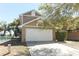 Attractive two-story home with an attached garage and manicured shrubs, set in a sunny location at 3623 S Saint Lucie Dr, Casselberry, FL 32707