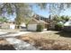 Charming two-story home featuring an attached garage, mature landscaping, and a classic architectural style at 3623 S Saint Lucie Dr, Casselberry, FL 32707