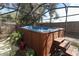 Close-up of above ground hot tub inside screened-in patio area at 3623 S Saint Lucie Dr, Casselberry, FL 32707