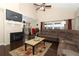 Open living room features a fireplace, hardwood floors, and a comfortable seating area with ample natural light at 3623 S Saint Lucie Dr, Casselberry, FL 32707