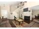 Bright living space with a fireplace, hardwood floors, comfortable seating, and an open staircase at 3623 S Saint Lucie Dr, Casselberry, FL 32707