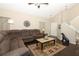 Spacious living room boasts a plush sectional sofa, hardwood floors, and a high vaulted ceiling at 3623 S Saint Lucie Dr, Casselberry, FL 32707