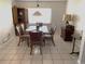 Cozy dining room with tile floors and natural light at 5220 Jade Cir, Orlando, FL 32812