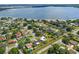 Aerial view of a residential neighborhood near a lake, showcasing the homes and surrounding landscape at 5220 Jade Cir, Orlando, FL 32812