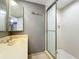 Bathroom with a sliding door shower stall, a shower, and a white sink at 5401 Elm Ct # 303, Orlando, FL 32811