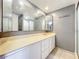 Bathroom featuring a full-length mirror over the vanity, a sink, and a shower stall at 5401 Elm Ct # 303, Orlando, FL 32811