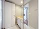 Bathroom with marble countertop, white cabinets, and mirror at 5401 Elm Ct # 303, Orlando, FL 32811