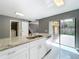 Modern kitchen with stainless steel appliances, granite countertops, and a door to the backyard at 5401 Elm Ct # 303, Orlando, FL 32811
