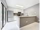 Modern kitchen featuring stainless steel appliances, granite countertops, and white cabinets at 5401 Elm Ct # 303, Orlando, FL 32811