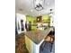 Bright eat-in kitchen with an island with seating, open shelves, and a walk-in pantry at 548 Big Sioux Ct, Kissimmee, FL 34759