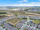 Expansive aerial view of a developing community, showcasing modern homes and open spaces at 5499 Orange Orchard Dr, Winter Garden, FL 34787