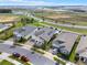 An aerial shows a residential neighborhood with well-kept lawns and convenient street access for each property at 5499 Orange Orchard Dr, Winter Garden, FL 34787
