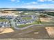 Panoramic aerial shot of a residential community with modern homes, lush green spaces, and scenic surroundings at 5499 Orange Orchard Dr, Winter Garden, FL 34787