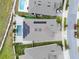 Aerial view of the property showcasing the pool, solar panels, landscaped yard, and paver patio at 5499 Orange Orchard Dr, Winter Garden, FL 34787