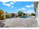 A view of the luxurious pool area featuring well-manicured landscaping, a stone-paved patio, and a serene outdoor setting at 5499 Orange Orchard Dr, Winter Garden, FL 34787