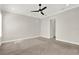 Spacious bedroom with a ceiling fan and carpet flooring at 5499 Orange Orchard Dr, Winter Garden, FL 34787