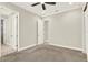 Bedroom featuring a ceiling fan and multiple doors and entryways at 5499 Orange Orchard Dr, Winter Garden, FL 34787