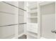 Walk-in closet with ample shelving and hanging space, providing organized storage solutions at 5499 Orange Orchard Dr, Winter Garden, FL 34787