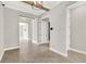 Hallway showcasing wood-look floors and neutral paint, leading to various rooms at 5499 Orange Orchard Dr, Winter Garden, FL 34787