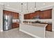 Gourmet kitchen featuring stainless steel appliances, granite countertops, and a large center island at 5499 Orange Orchard Dr, Winter Garden, FL 34787