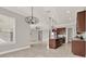 Spacious kitchen with a view to the dining and living areas at 5499 Orange Orchard Dr, Winter Garden, FL 34787