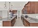 Gorgeous kitchen with a large island featuring granite countertops, and stainless steel appliances at 5499 Orange Orchard Dr, Winter Garden, FL 34787
