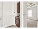 Mudroom with built-in storage cabinets and granite countertop near entry and bedroom at 5499 Orange Orchard Dr, Winter Garden, FL 34787