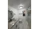Updated bathroom featuring granite countertop, glass shower, tile flooring, and modern fixtures at 636 Coke Ave, Winter Garden, FL 34787