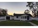Charming single-story home with detached garage and well-maintained lawn at 636 Coke Ave, Winter Garden, FL 34787