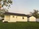 Exterior view of home showing detached garage and well-maintained lawn at 636 Coke Ave, Winter Garden, FL 34787