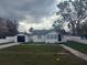 Charming home featuring a freshly painted exterior, detached garage and newly installed white vinyl fence at 636 Coke Ave, Winter Garden, FL 34787
