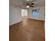Inviting living room boasts hardwood floors, a ceiling fan, and well-lit spaces with fresh paint at 636 Coke Ave, Winter Garden, FL 34787