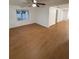 Spacious living room with light hardwood floors, ceiling fan, and crisp white walls at 636 Coke Ave, Winter Garden, FL 34787