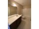 Well-lit bathroom featuring a vanity, commode, and shower-tub combo at 725 Northlake Blvd # 66, Altamonte Springs, FL 32701