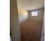 Bedroom featuring neutral carpet, and a bright window, creating a cozy and inviting space at 725 Northlake Blvd # 66, Altamonte Springs, FL 32701