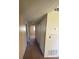 Hallway featuring neutral carpet and multiple storage closets at 725 Northlake Blvd # 66, Altamonte Springs, FL 32701