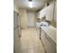 Efficient kitchen featuring white appliances and tile flooring at 725 Northlake Blvd # 66, Altamonte Springs, FL 32701