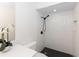 Modern bathroom with black accents, white subway tile, shower niche, and black shower head at 7549 Dockside St, Winter Park, FL 32792