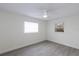 Cozy bedroom with natural light, ceiling fan, and neutral walls at 7549 Dockside St, Winter Park, FL 32792