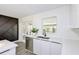 Modern kitchen featuring white cabinets, stainless steel appliances, and sleek countertops at 7549 Dockside St, Winter Park, FL 32792