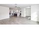 Bright open floor plan living area into modern kitchen with stylish flooring at 7549 Dockside St, Winter Park, FL 32792