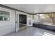 This is a beautiful screened patio with gray floors and modern black trim at 7549 Dockside St, Winter Park, FL 32792