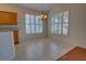 Dining area featuring tile floors, sunlit windows with shutters, and a modern chandelier at 781 Lakeworth Cir, Lake Mary, FL 32746